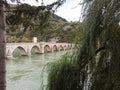 A view of famous bridge over Drina throug the trees, Visegrad, Bosna and Herzegovina