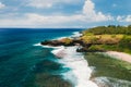 View of the famous Golden beach between black volcanic rocks on the banks of the Gris-Gris river, La Roche qui pleure in Mauritius