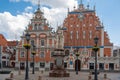 View of famous House of the Black Heads and Roland`s Statue during day in Riga