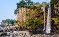 View of famous Jeongbang Waterfall on Jeju Island of Korea Royalty Free Stock Photo