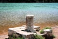 Roman pillar near the sea in the Lim canal in Croatia