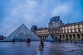 View of famous Louvre Museum and gallery with Louvre Pyramid in Paris France