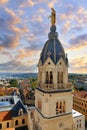 View of famous Marie statue on top of Notre-dame-de-fourviere basilica in Lyon at sunset Royalty Free Stock Photo