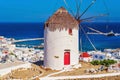 View of the famous Mykonos windmill above port and Mykonos town