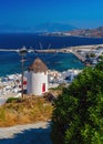 View of the famous Mykonos windmill above port and Mykonos town