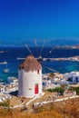 View of the famous Mykonos windmill above port and Mykonos town