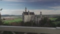 View of famous Neuschwanstein Schloss, Fussen, Bavaria, Germany, seen from Marienbrucke Marys Bridge, pedestrian bridge