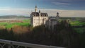 View of famous Neuschwanstein Schloss, Fussen, Bavaria, Germany, seen from Marienbrucke Marys Bridge, pedestrian bridge