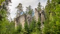 View of famous sandstone rock towers of Adrspach and Teplice Rocks and ancient pines growing between them.