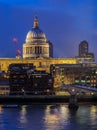 View of the famous St. Paul's Cathedral across the river Thames with Millennium Bridge in London, England Royalty Free Stock Photo