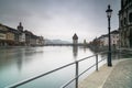 View of the famous Swiss city of Lucerne cityscape skyline and Kappel bridge with water tower and Jesuit church under an