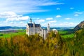 View of the famous tourist attraction in the Bavarian Alps - the 19th century Neuschwanstein castle. Royalty Free Stock Photo
