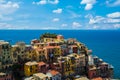 View of famous travel landmark destination Manarola colorful houses and nature, small mediterranean old sea town with