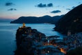 View of famous travel landmark destination Vernazza,small mediterranean old sea town with harbour coast and castle Royalty Free Stock Photo