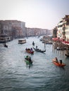 panoramic view of a Venice canal with water taxi and gondola