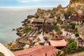 View of the famous village Popeye and bay on a sunny day. Anchor Bay, Malta Royalty Free Stock Photo