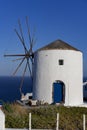 View of famous windmill in Oia