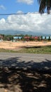 view of farmers drying corn with views of mountains and blue skies