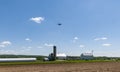 View of Farmlands With Barns, Silos, and s Drone Flying on a Sunny Day