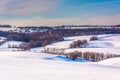 View of farms and snow-covered rolling hills in rural York Count