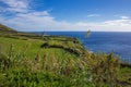 View of Farol da Ponta da Ferraria lighthouse from Miradouro da Ilha Sabrina, Sao Miguel Island, Azores, Portugal Royalty Free Stock Photo