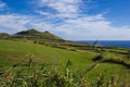 View of Farol da Ponta da Ferraria lighthouse from Miradouro da Ilha Sabrina, Sao Miguel Island, Azores, Portugal Royalty Free Stock Photo