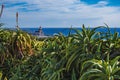 View of Farol da Ponta da Ferraria lighthouse from Miradouro da Ilha Sabrina, Sao Miguel Island, Azores, Portugal Royalty Free Stock Photo