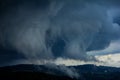 view of fast approaching clouds in the mountains during a hellish storm