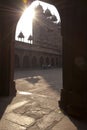 View of Fatehpur Sikri from inside an arched gateway, India.