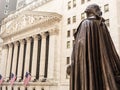 View from Federal Hall of the statue of George Washington and the Stock Exchange building in Wall Street, New York City.