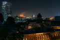 View of Federal Hill and the Domino Sugars Factory at night in Baltimore, Maryland