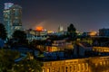 View of Federal Hill and the Domino Sugars Factory at night in Baltimore, Maryland