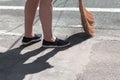 View of feet and broom Royalty Free Stock Photo