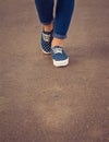 View of feet in sneakers and jeans Royalty Free Stock Photo