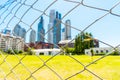 View of the fence on the background of a skyscraper, Buenos Aires, Argentina. With selective focus