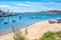 View on the Ferragudo and Portimao Algarve across the river and many fishing boats in the foreground Royalty Free Stock Photo