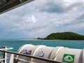 View ferry boat ocean warm blue light water sea ocean gulf thailand green rain forest trees beach clouds sky koh samui Royalty Free Stock Photo