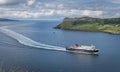 A view of a ferry coming inro uig port that has come from tarbert port
