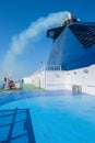 View of the ferry in the sea and the smoke from the chimney. Transport and travel concept