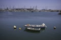 View of a few sailing boats along the shoreline in the river in Lagos, Algarve, Portugal Royalty Free Stock Photo