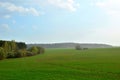 View of a field with green grass during the rainy. Spring weather during short rain Royalty Free Stock Photo