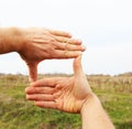 View at country field through hand frame Royalty Free Stock Photo