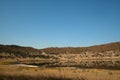 VIEW OF METEOR CRATER LAKE WITH VEGETATION IN WINTER