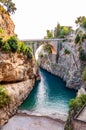 View on Fiordo di Furore arc bridge built between high rocky cliffs above the Tyrrhenian sea bay in Campania region. Unique cove Royalty Free Stock Photo