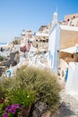 View of Fira town - Santorini island,Crete,Greece. White concrete staircases leading down to beautiful bay with clear blue sky Royalty Free Stock Photo