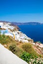 View of Fira town - Santorini island,Crete,Greece. White concrete staircases leading down to beautiful bay with clear blue sky Royalty Free Stock Photo