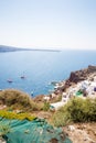View of Fira town - Santorini island,Crete,Greece. White concrete staircases leading down to beautiful bay with clear blue sky Royalty Free Stock Photo