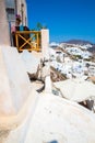 View of Fira town - Santorini island,Crete,Greece. White concrete staircases leading down to beautiful bay with clear blue sky Royalty Free Stock Photo