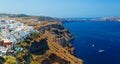 View of Fira village built on top of volcano cliff and blue sea Santorini island, Greece Royalty Free Stock Photo