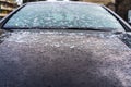 View of a first layer of snow on a car in the morning in wintertime in Bucharest, Romania Royalty Free Stock Photo